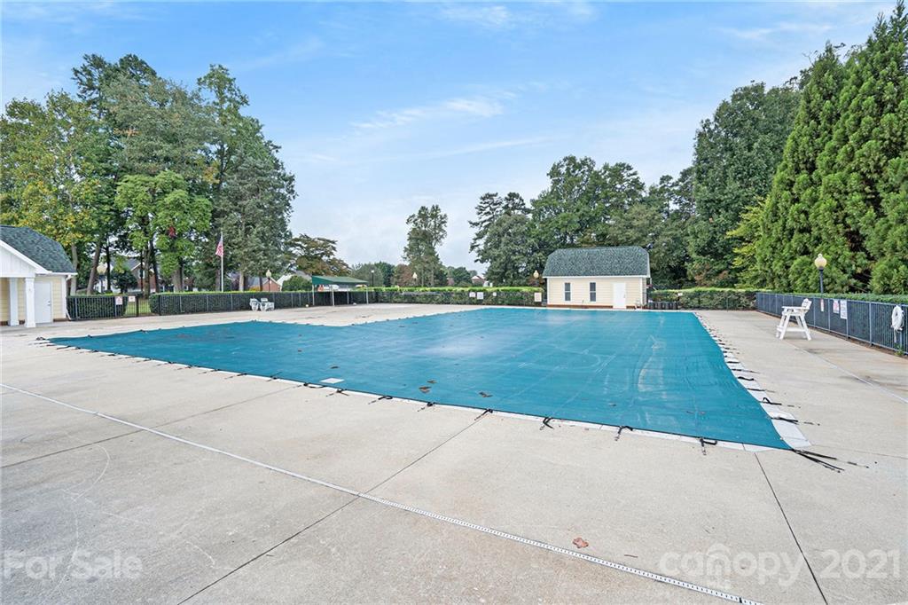 9379 Hillston Ridge Road Huntersville, NC 28078 - Photo 38 of 38 a view of a swimming pool with an outdoor space and seating area