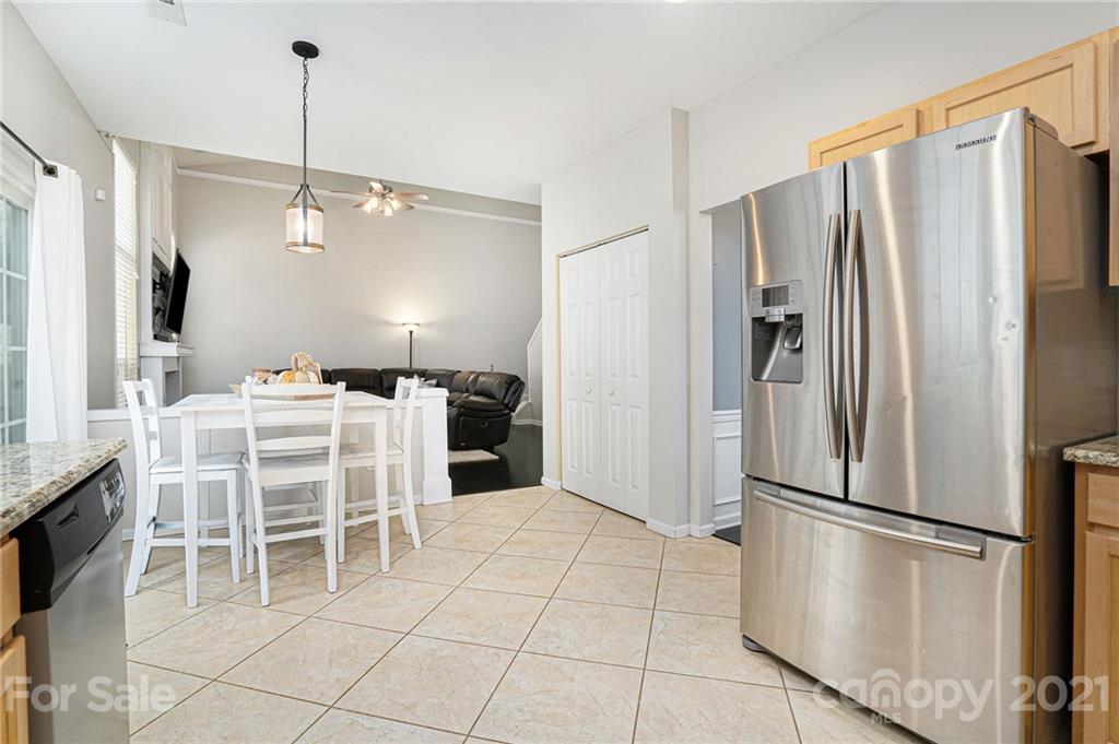 9379 Hillston Ridge Road Huntersville, NC 28078 - Photo 9 of 38 a kitchen with stainless steel appliances a refrigerator and microwave