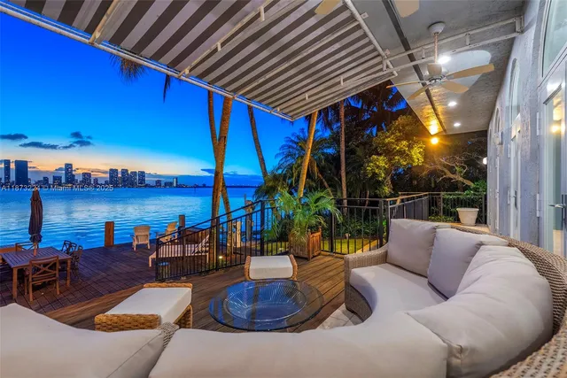 a roof deck with couches and city view