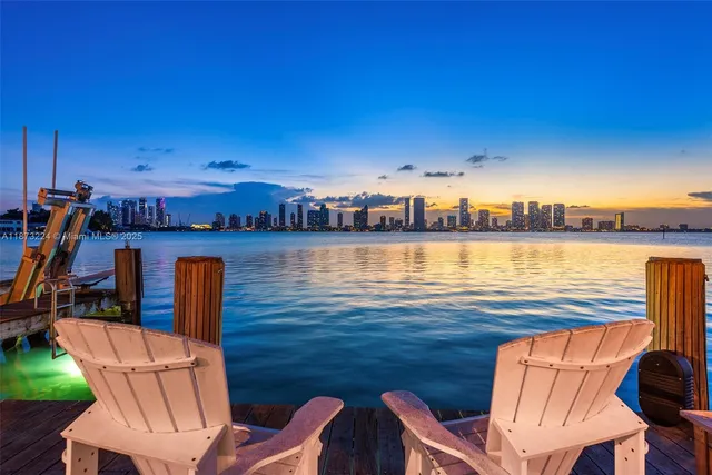 a view of a patio with furniture and wooden floor
