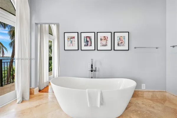 a white bath tub sitting in a bathroom