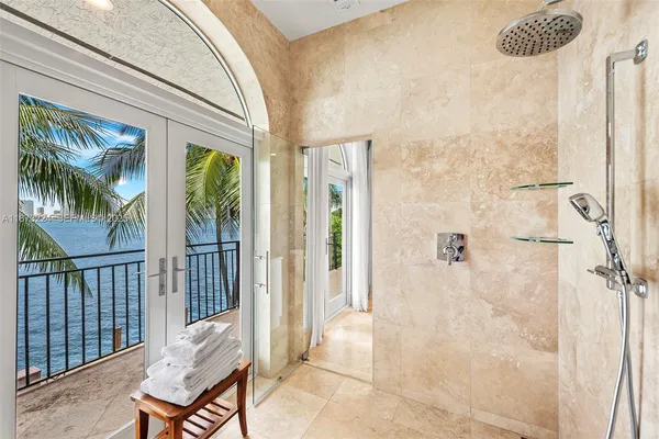 a view of a hallway with furniture and front door