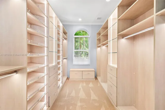 a view of a hallway with windows