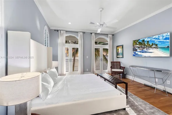 a living room with a couch and a chandelier