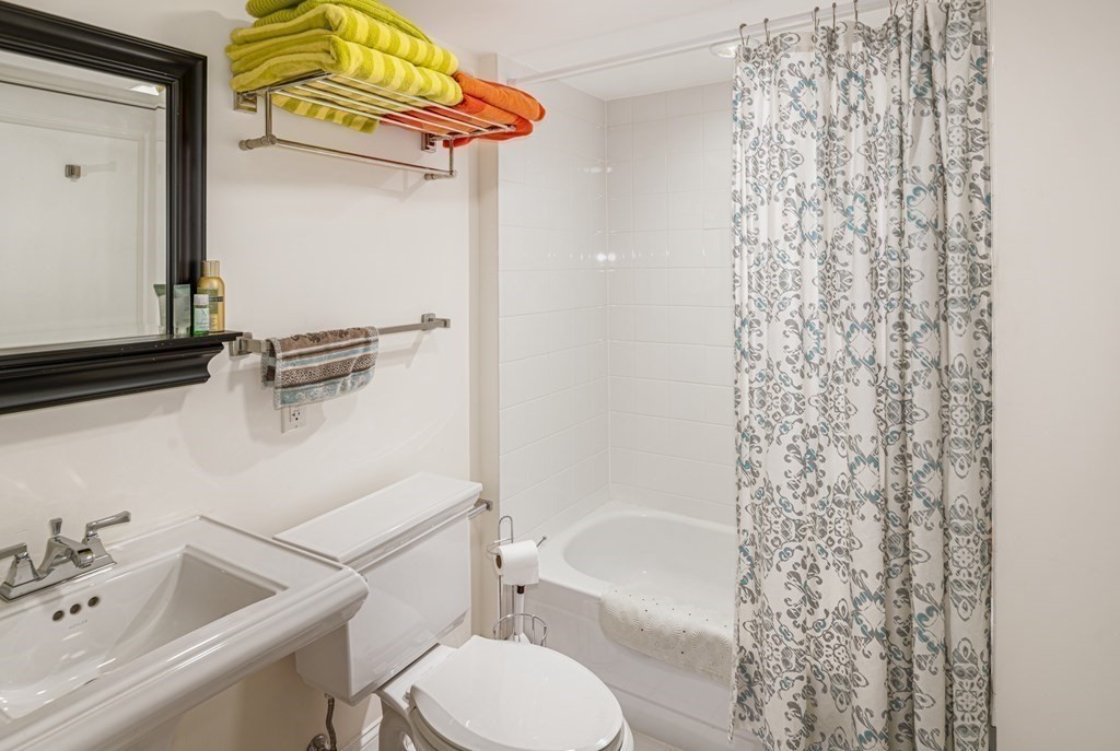 44 Prince Street, Unit 412 Boston, MA 02113 - Photo 12 of 19 a bathroom with a sink a toilet and bathtub