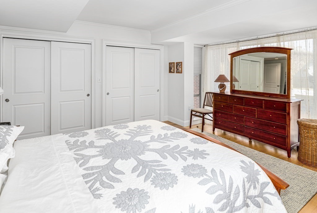 44 Prince Street, Unit 412 Boston, MA 02113 - Photo 14 of 19 a bedroom with a bed and a dresser in it