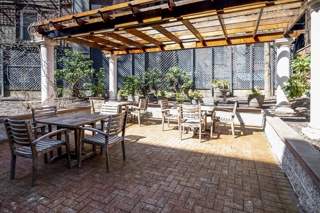 44 Prince Street, Unit 412 Boston, MA 02113 - Photo 19 of 19 a view of a patio with table and chairs and potted plants