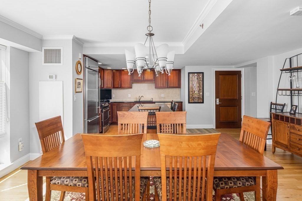 44 Prince Street, Unit 412 Boston, MA 02113 - Photo 2 of 19 a large kitchen with a table and chairs
