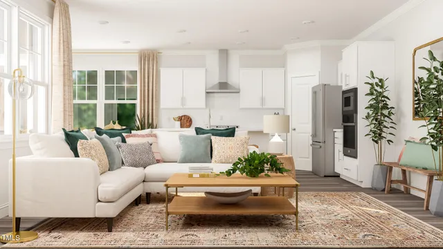 a living room with furniture and a potted plant