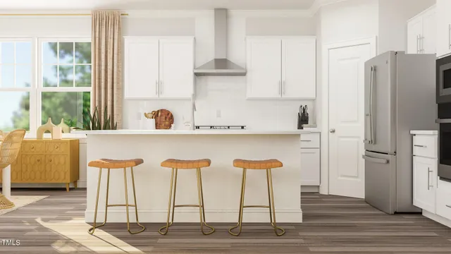 a kitchen with stainless steel appliances kitchen island granite countertop a refrigerator and a stove top oven