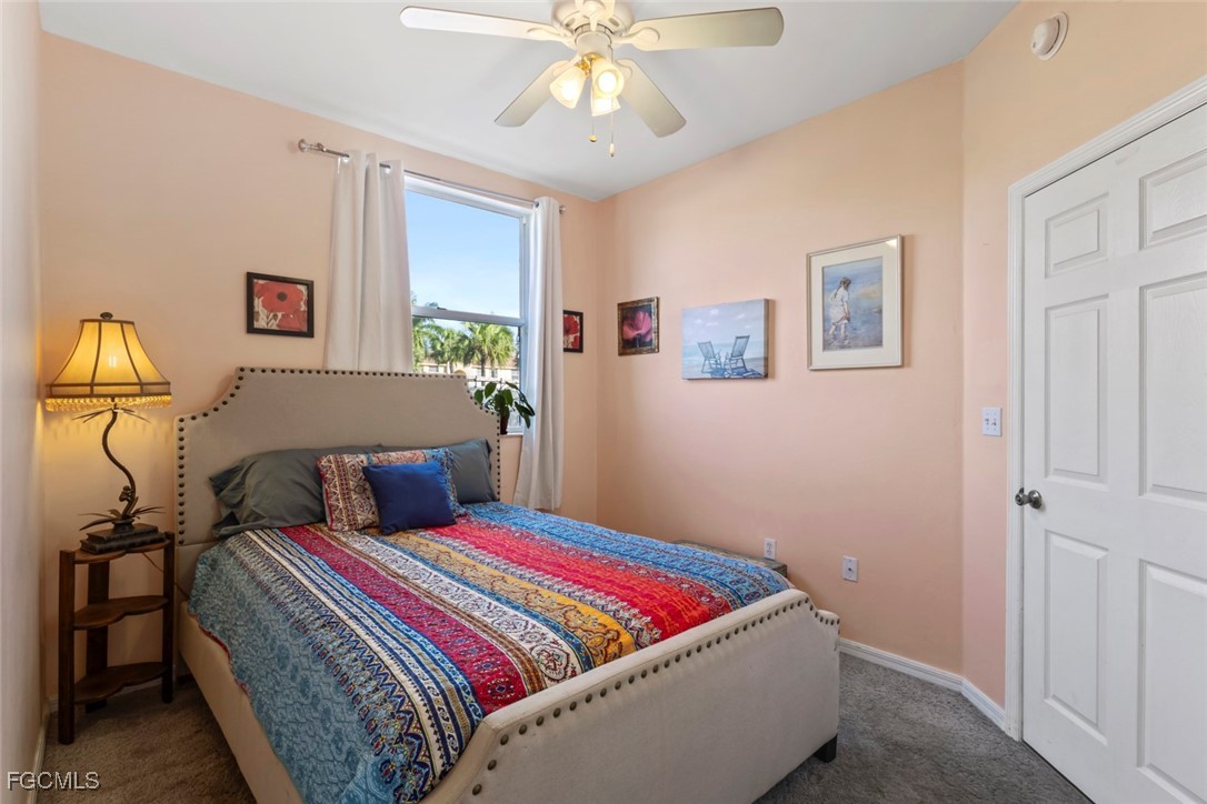 15430 Bellamar Circle, Unit 3014 Fort Myers, FL 33908 - Photo 14 of 20 a bedroom with bed and window