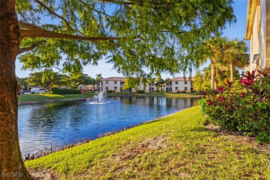 15430 Bellamar Circle, Unit 3014 Fort Myers, FL 33908 - Photo 17 of 20 a view of a lake with trees