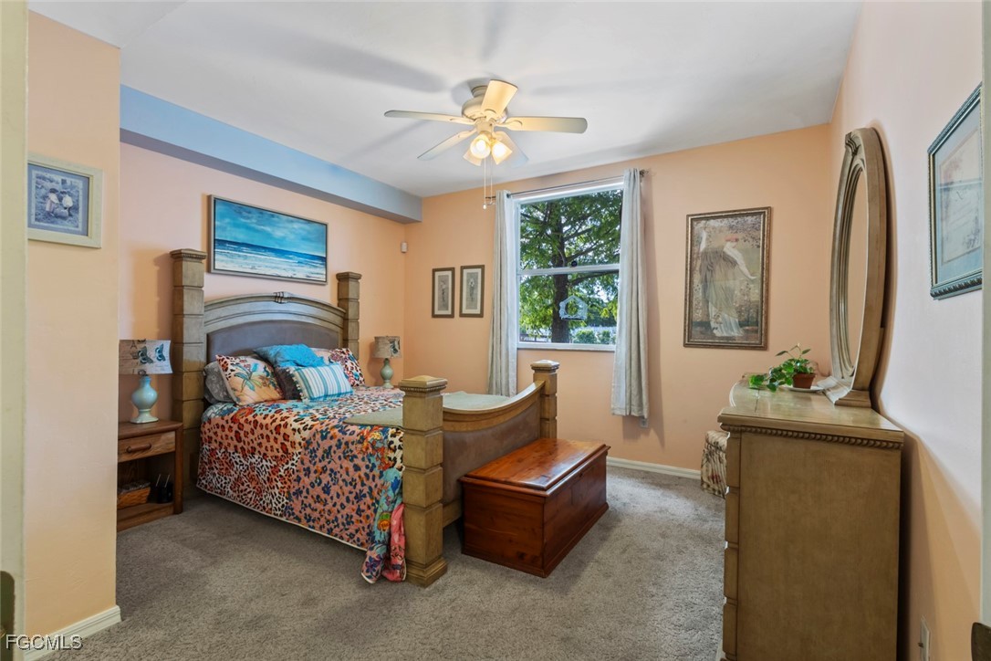 15430 Bellamar Circle, Unit 3014 Fort Myers, FL 33908 - Photo 4 of 20 a living room with furniture and a window