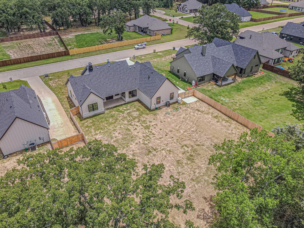 360 Dalton Road Canton, TX 75103 - Photo 32 of 33 Contemporary single-story residence with a black shingle roof and white siding