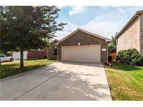 2207 Terrell Drive Grand Prairie, TX 75052 - Photo 1 of 1 a front view of a house with a yard and garage