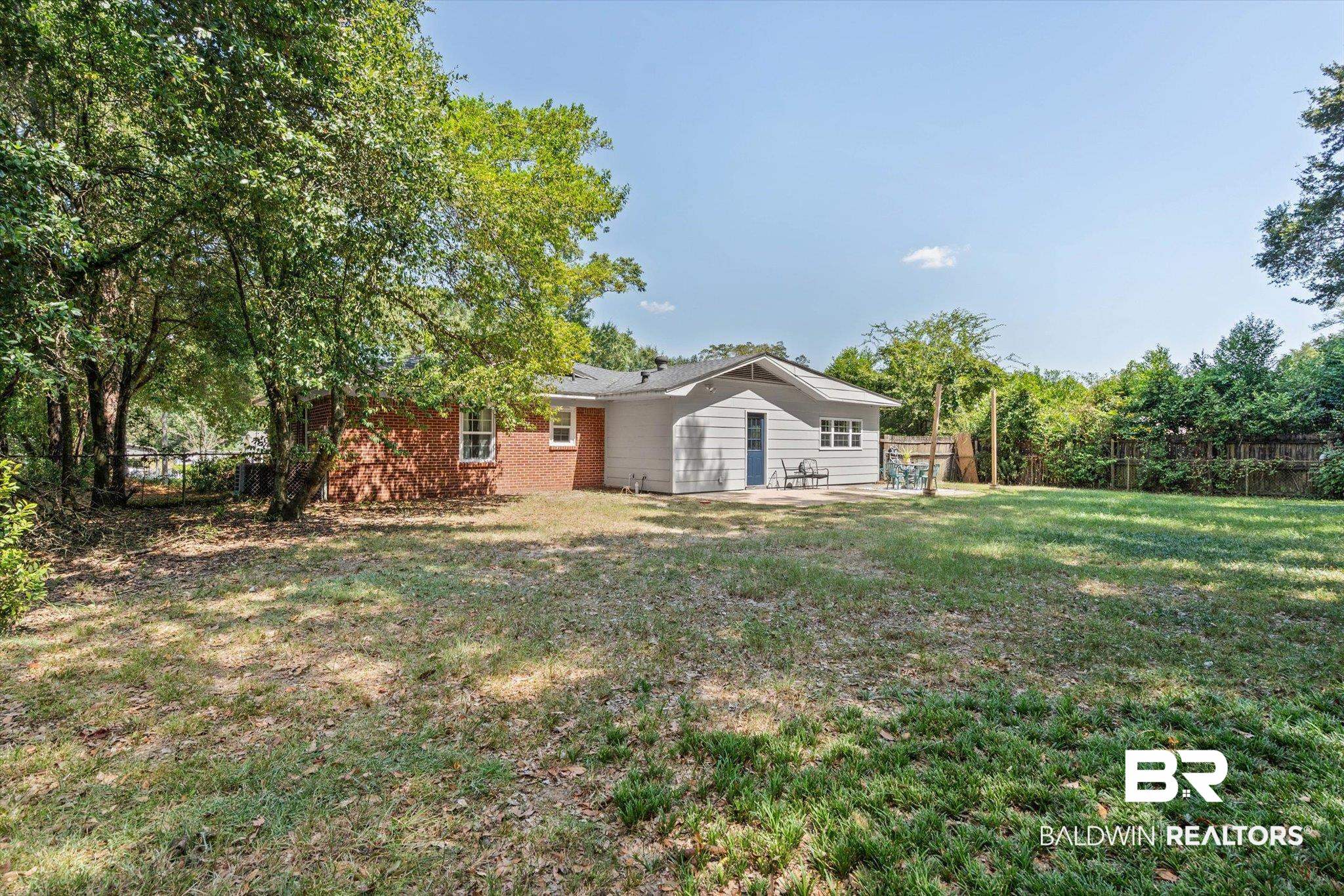 5609 Diane Court Mobile, AL 36618 - Photo 19 of 22 Fenced backyard featuring a patio area