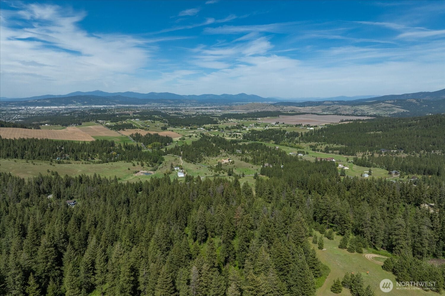-xxx South Jackson Road, Unit LOT 17 Mica, WA 99023 - Photo 6 of 40 a view of a city with sunset view
