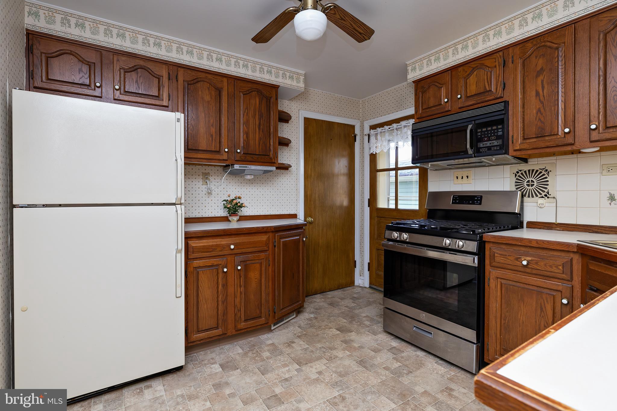408 Yale Road Haddonfield, NJ 08033 - Photo 11 of 29 a kitchen with stainless steel appliances granite countertop a refrigerator stove and microwave
