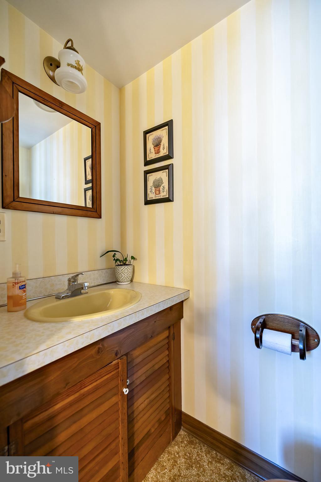408 Yale Road Haddonfield, NJ 08033 - Photo 14 of 29 a bathroom with a granite countertop sink and a mirror