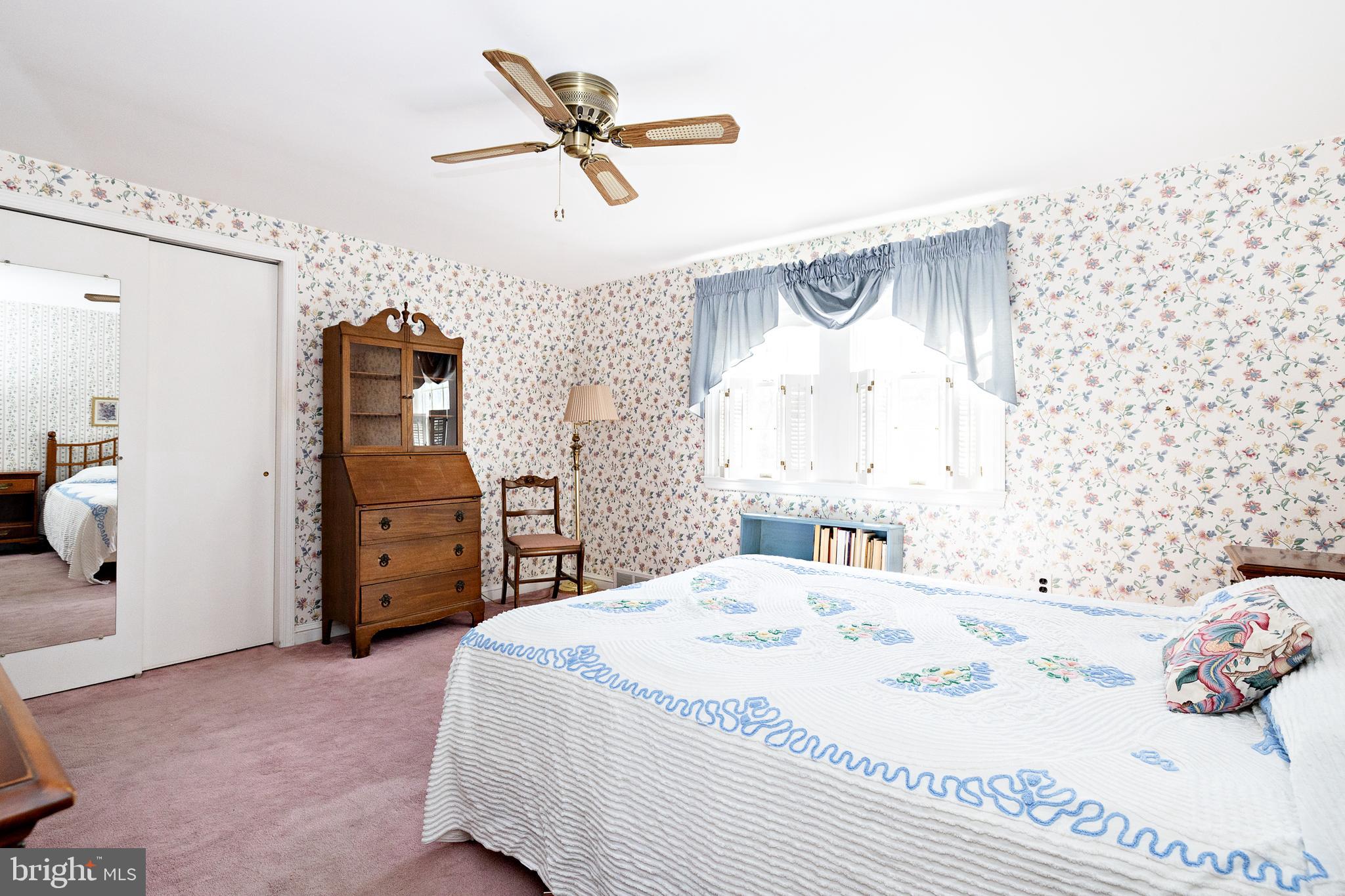 408 Yale Road Haddonfield, NJ 08033 - Photo 20 of 29 a bedroom with a bed and a chandelier