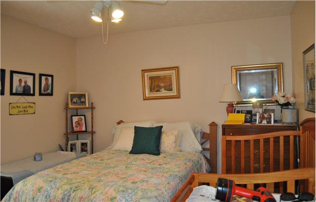 9575 Powells Chapel Road Murfreesboro, TN 37129 - Photo 11 of 18 a bedroom with a bed and a flat tv screen on dresser