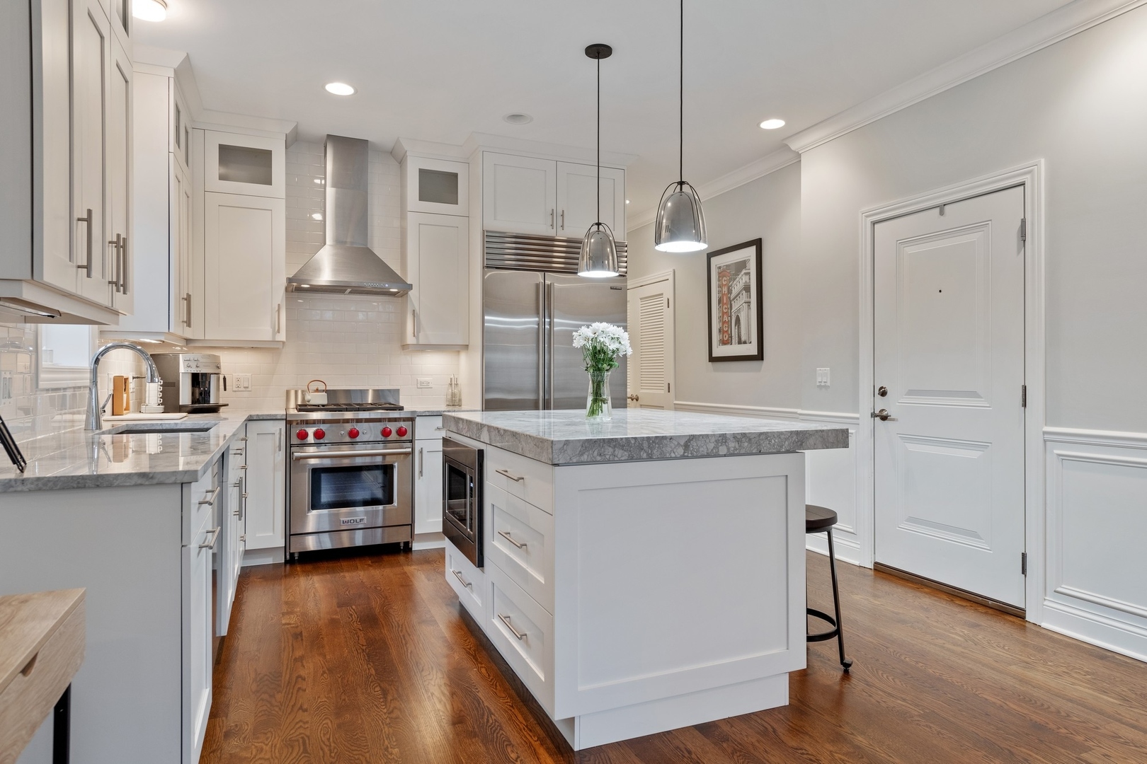2019 North Racine Avenue, Unit 2 Chicago, IL 60614 - Photo 5 of 14 a kitchen with stainless steel appliances granite countertop a stove and a refrigerator