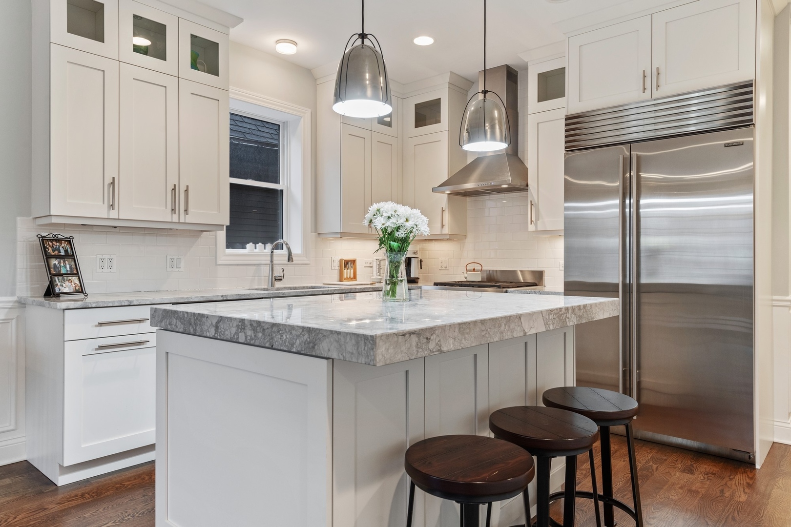 2019 North Racine Avenue, Unit 2 Chicago, IL 60614 - Photo 6 of 14 a kitchen with stainless steel appliances granite countertop a sink refrigerator and cabinets
