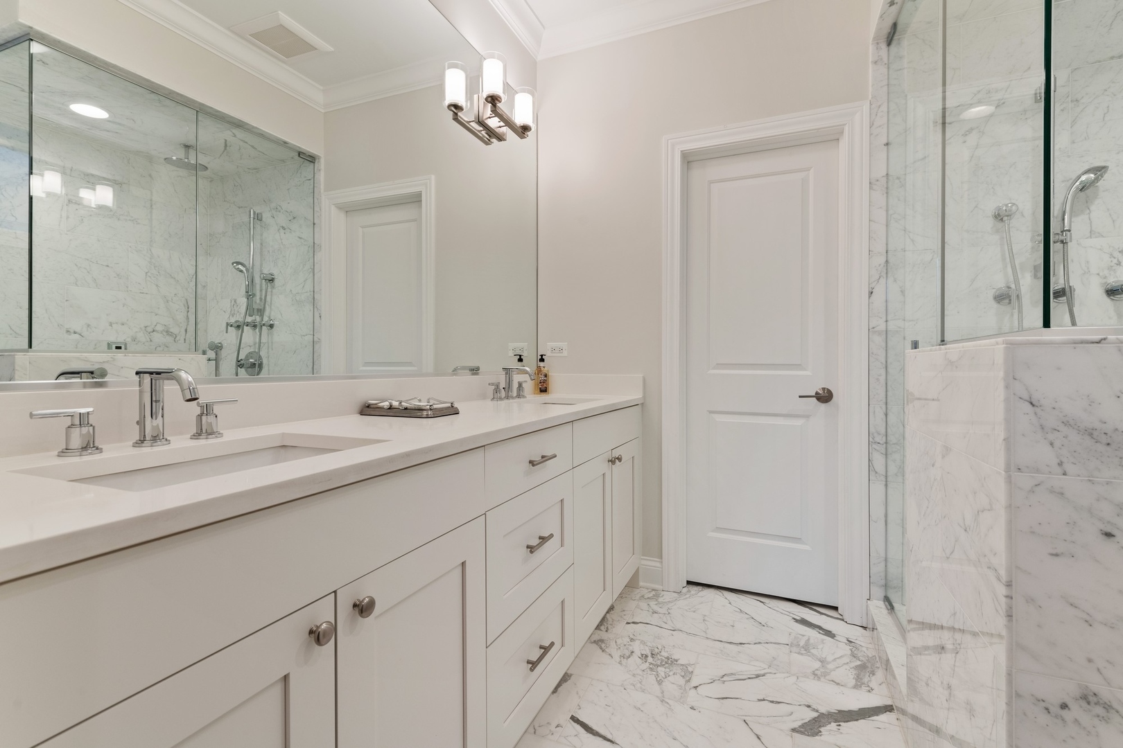 2019 North Racine Avenue, Unit 2 Chicago, IL 60614 - Photo 9 of 14 a bathroom with a double vanity sink and a mirror