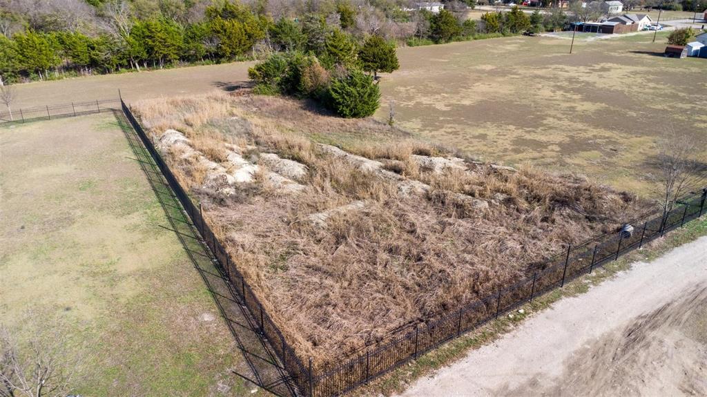 20 South Lancaster Hutchins Road Lancaster, TX 75146 - Photo 7 of 14 Fenced land parcel featuring a perimeter fence and a partially cleared area