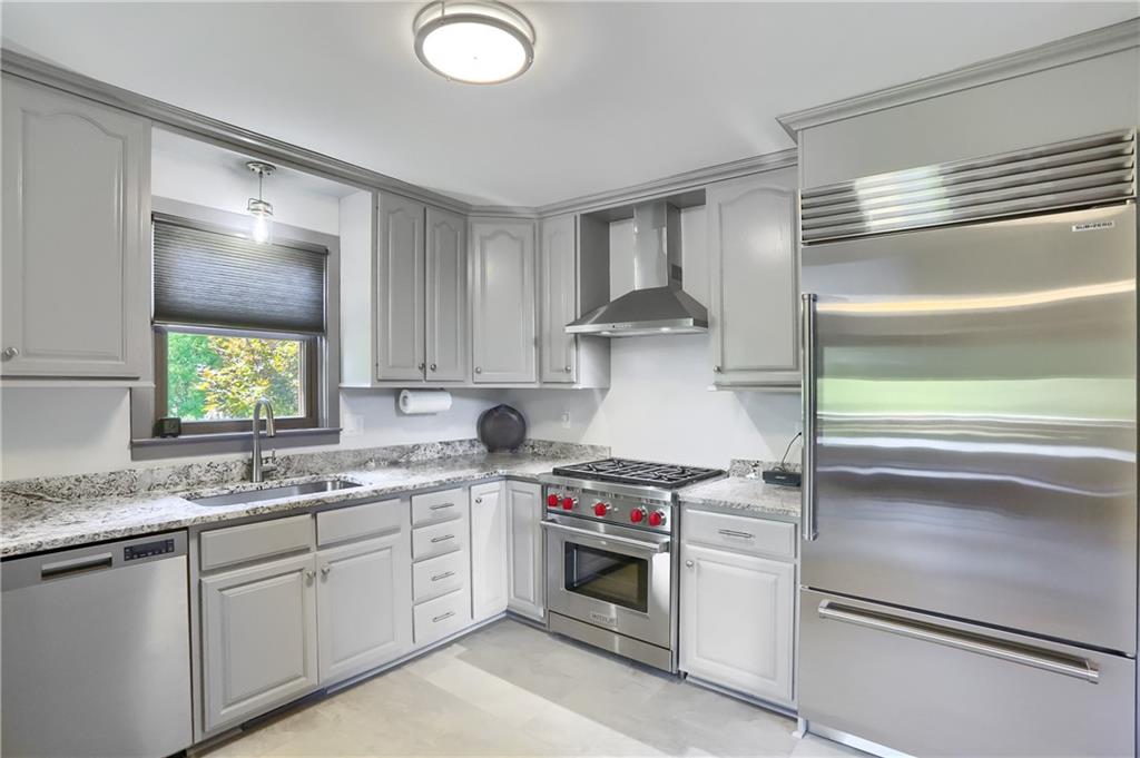 595 Trusel Road Portersville, PA 16051 - Photo 14 of 48 a kitchen with a sink stove and cabinets