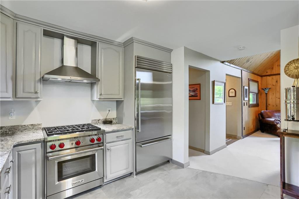 595 Trusel Road Portersville, PA 16051 - Photo 17 of 48 a kitchen with stainless steel appliances granite countertop a stove and a refrigerator