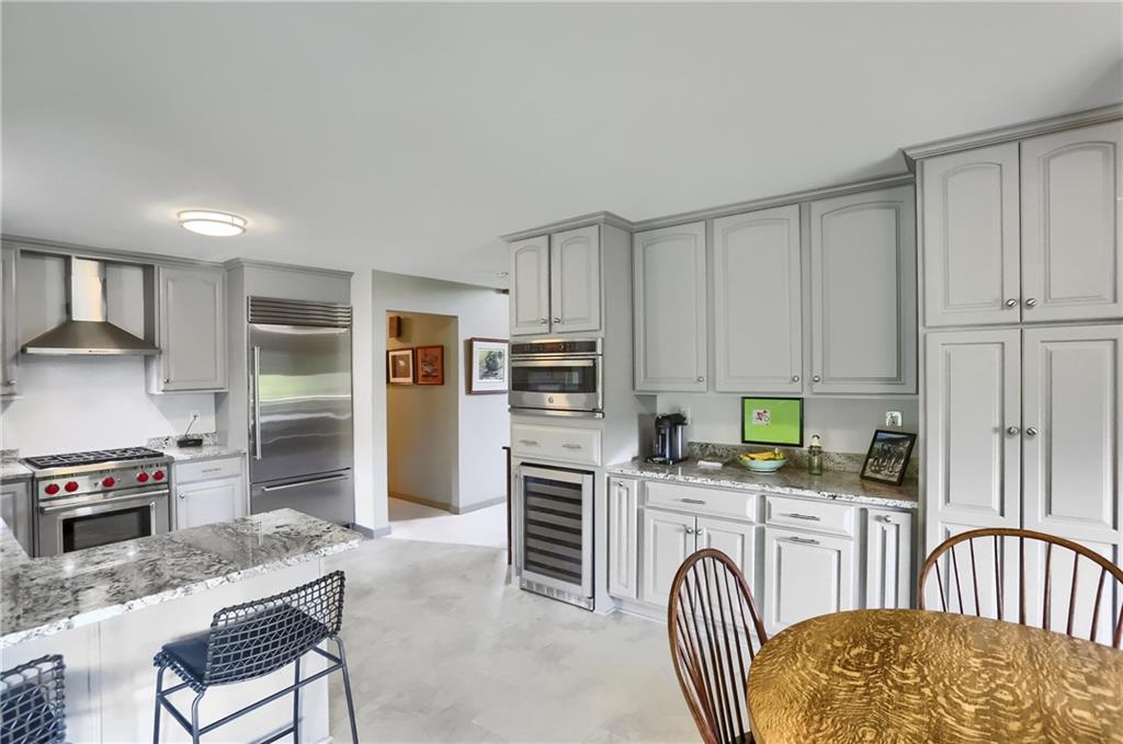 595 Trusel Road Portersville, PA 16051 - Photo 24 of 48 a kitchen with stainless steel appliances granite countertop a stove top oven a refrigerator a sink and dishwasher