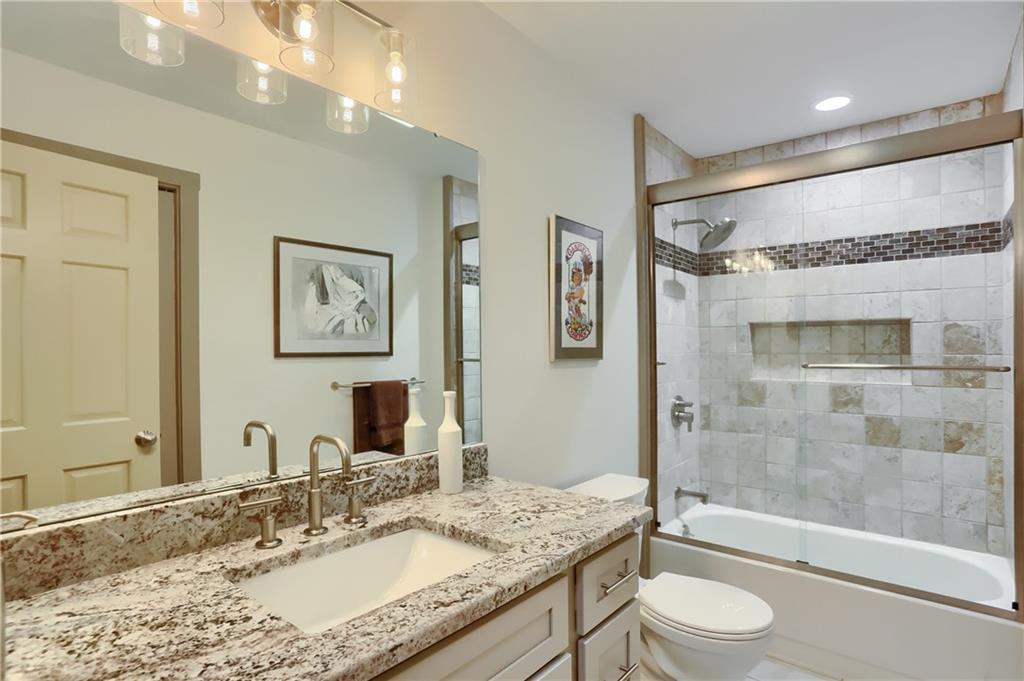 595 Trusel Road Portersville, PA 16051 - Photo 27 of 48 a bathroom with a granite countertop sink toilet and shower