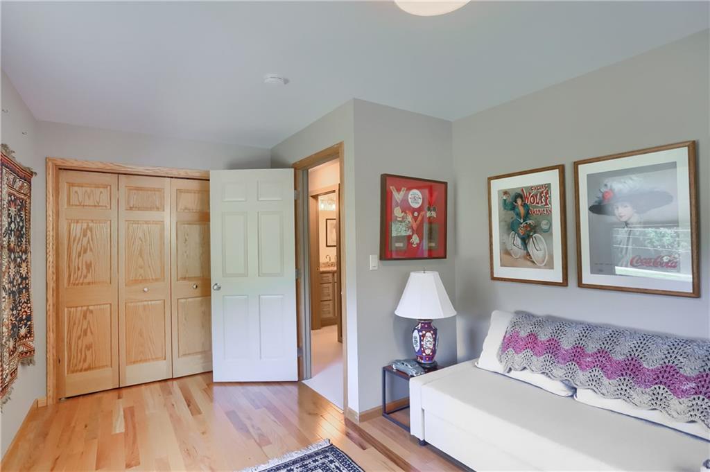 595 Trusel Road Portersville, PA 16051 - Photo 30 of 48 a spacious bedroom with a bed and a painting on the wall