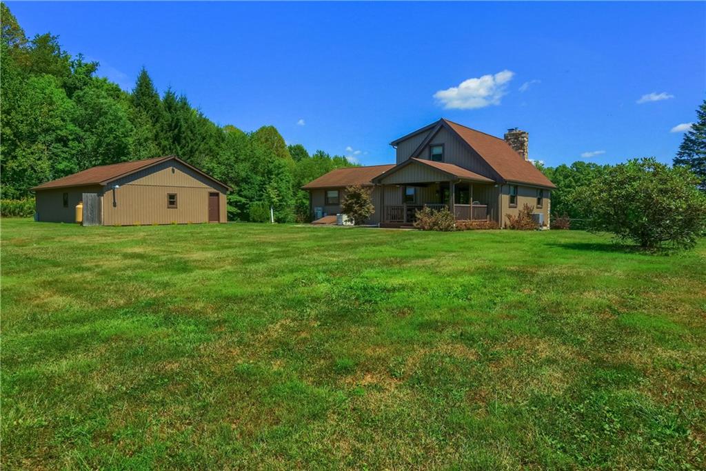 595 Trusel Road Portersville, PA 16051 - Photo 40 of 48 a big house with a big yard and large trees