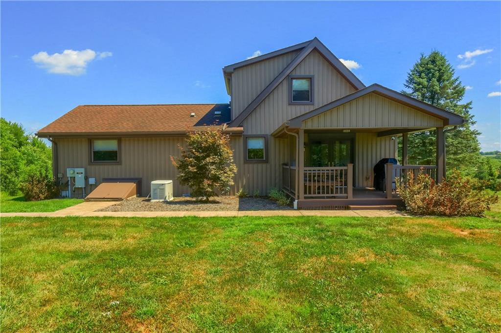 595 Trusel Road Portersville, PA 16051 - Photo 42 of 48 a front view of a house with a yard and garage