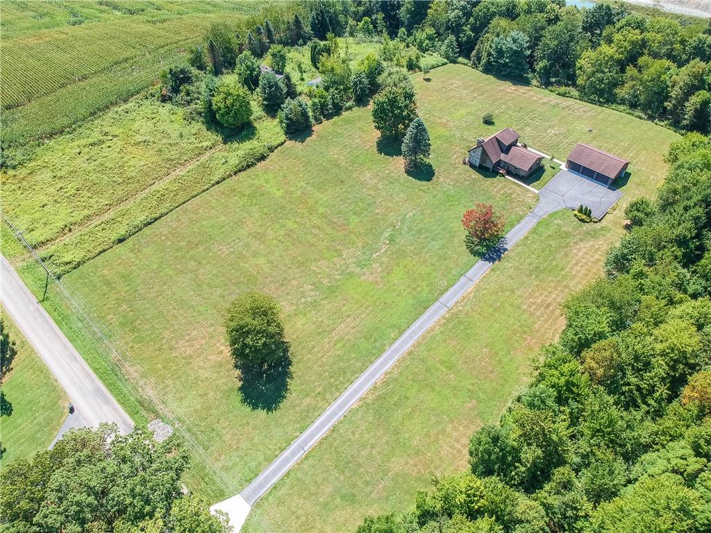 595 Trusel Road Portersville, PA 16051 - Photo 47 of 48 a view of a swimming pool with a plants and flowers
