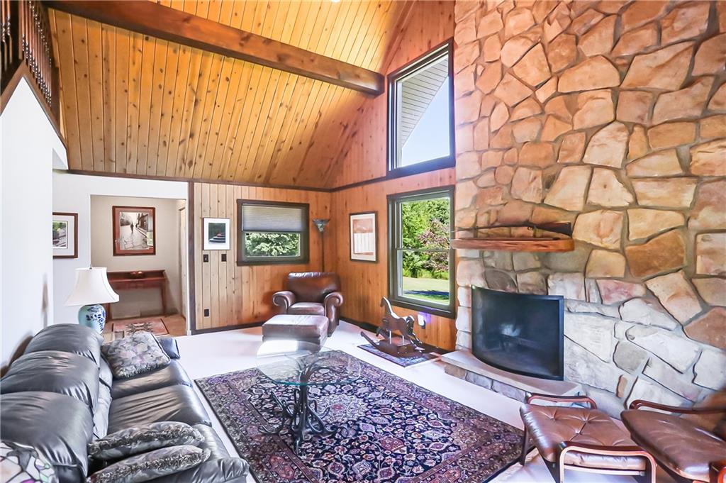 595 Trusel Road Portersville, PA 16051 - Photo 10 of 48 a living room with furniture a rug and a fireplace