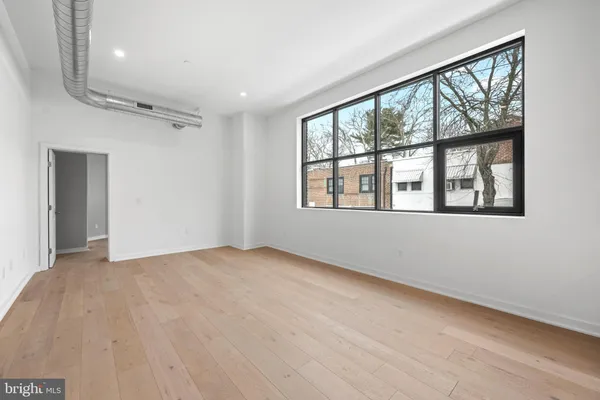 a view of an empty room with a window