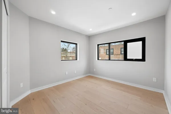 a bathroom with a toilet sink vanity and shower