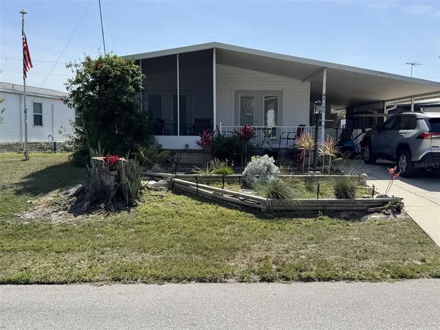 a view of a house with backyard tub and fire pit