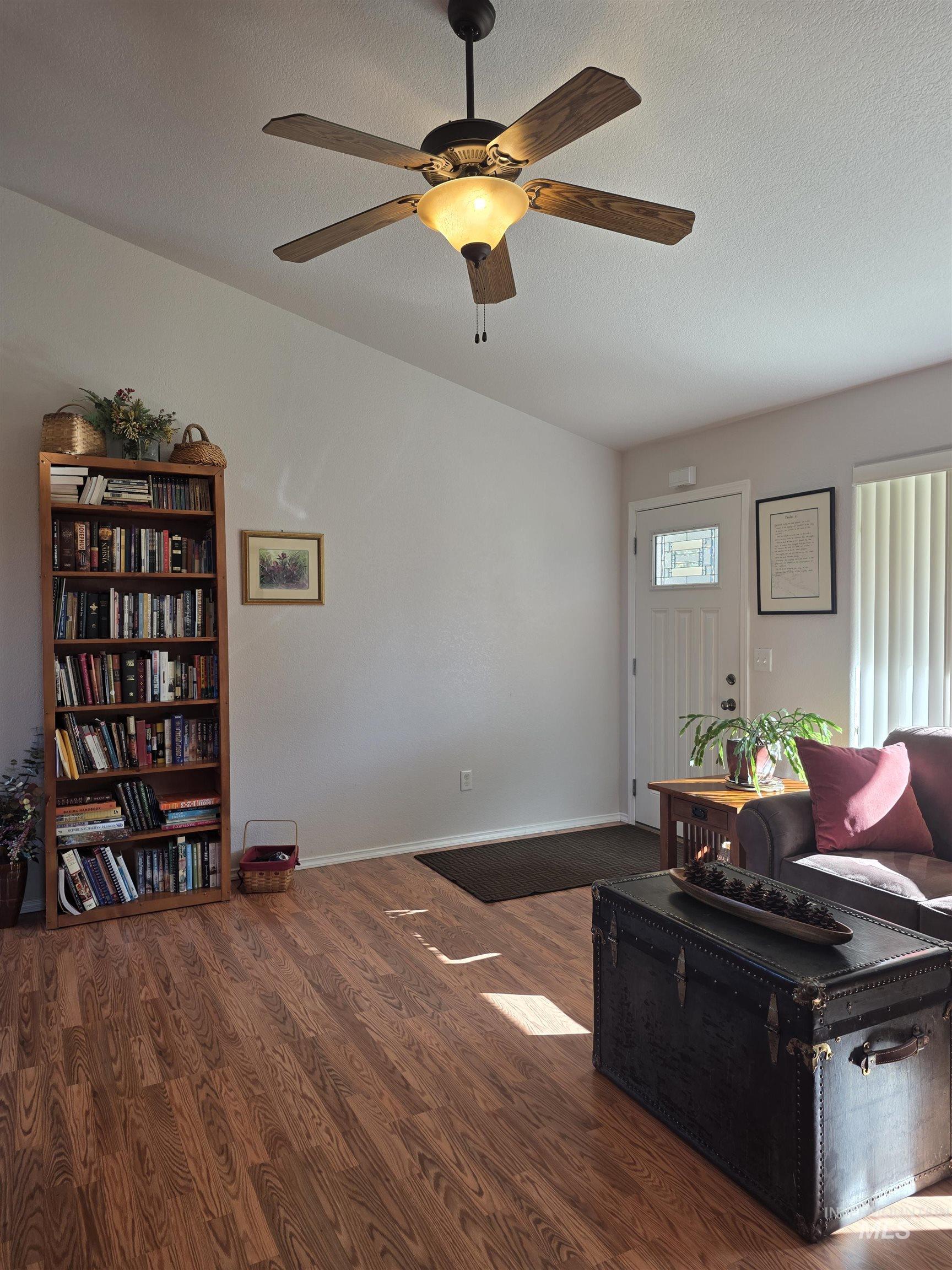 5288 Lakeview Road Orofino, ID 83544 - Photo 11 of 36 Living room featuring wood finished floors, a ceiling fan, and a textured ceiling