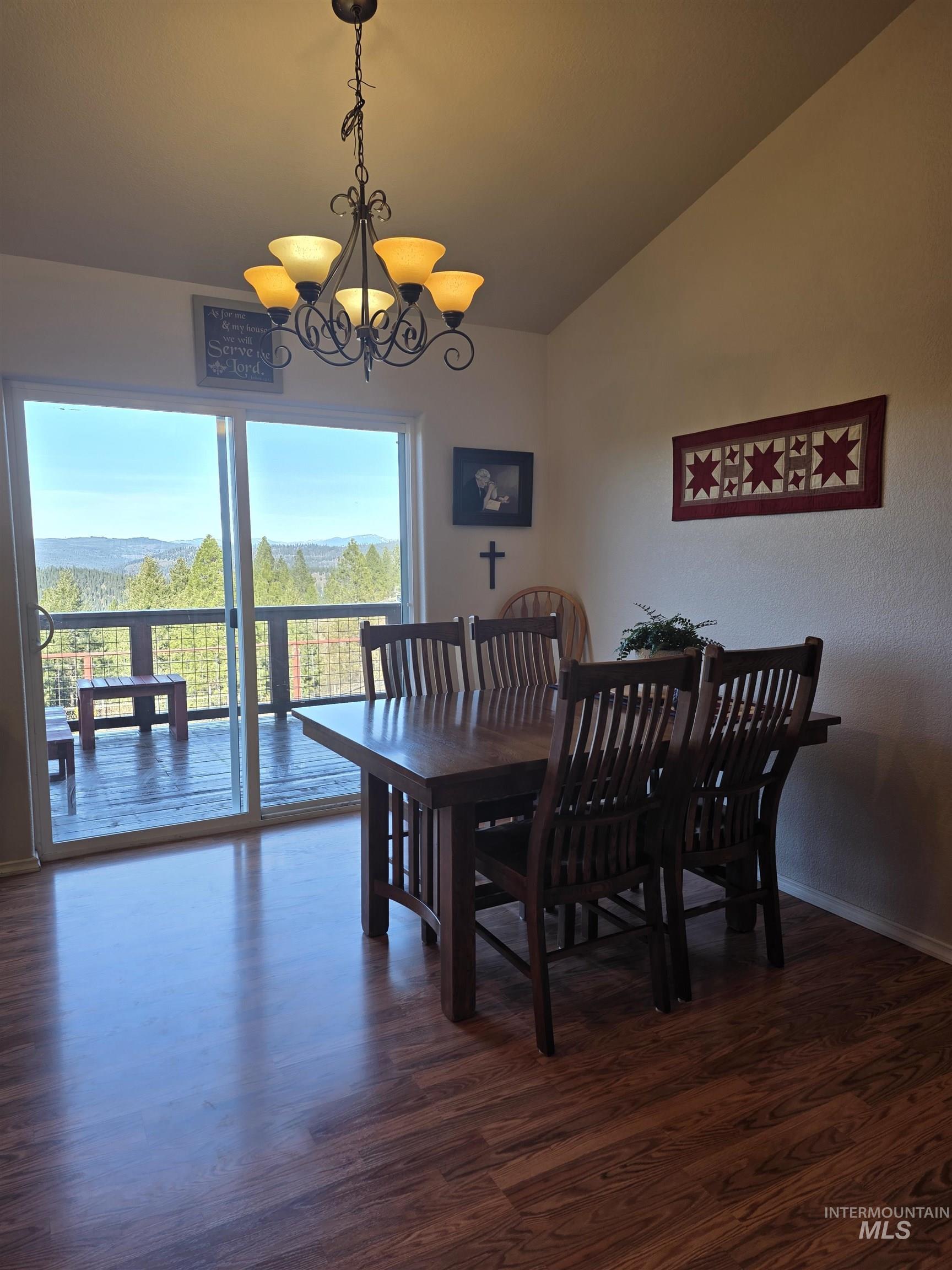 5288 Lakeview Road Orofino, ID 83544 - Photo 13 of 36 Dining space with suspended lighting, dark wood-style flooring, and lofted ceiling