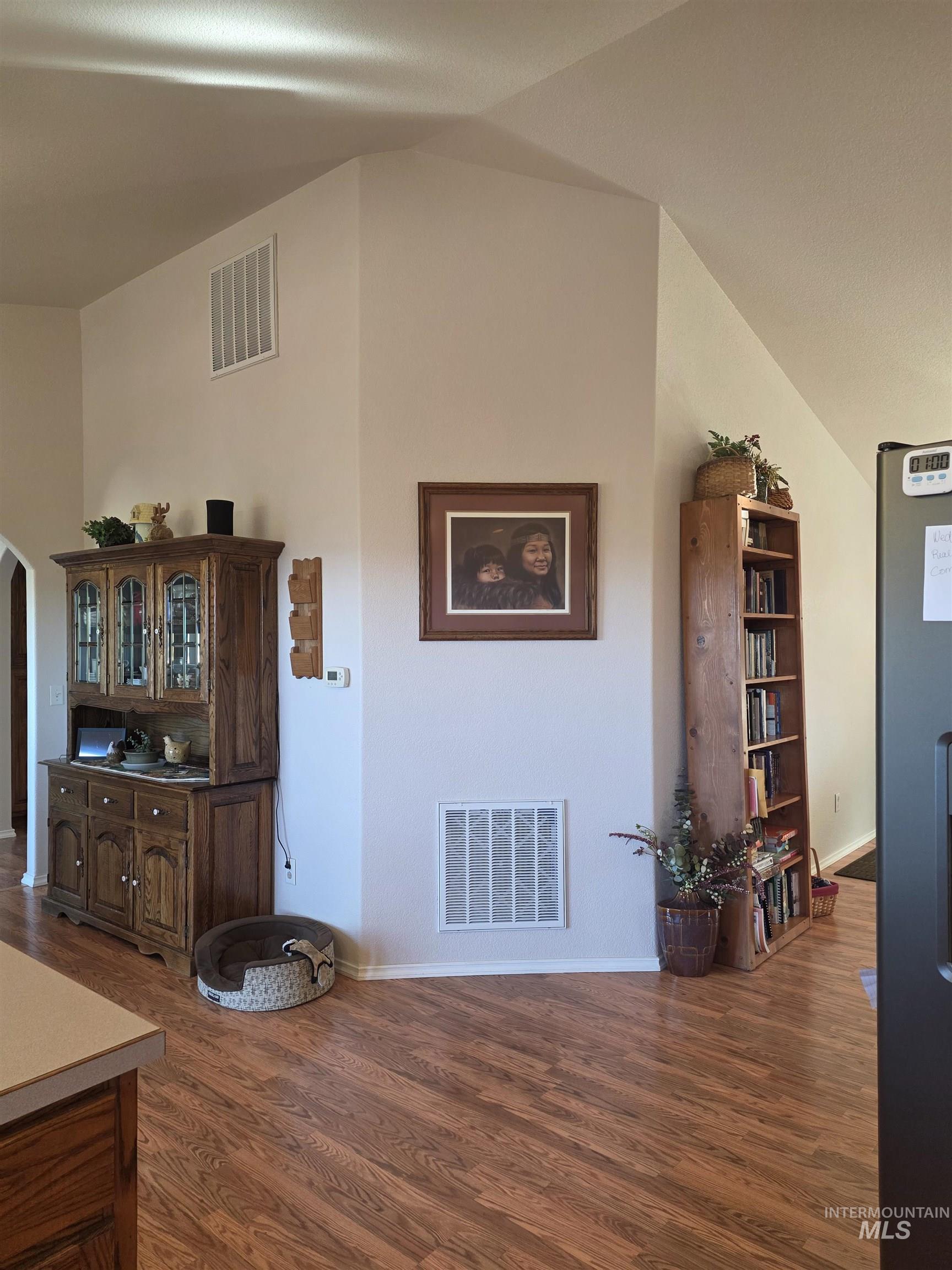 5288 Lakeview Road Orofino, ID 83544 - Photo 15 of 36 Dining room featuring dark wood-style flooring, arched walkways, and lofted ceiling