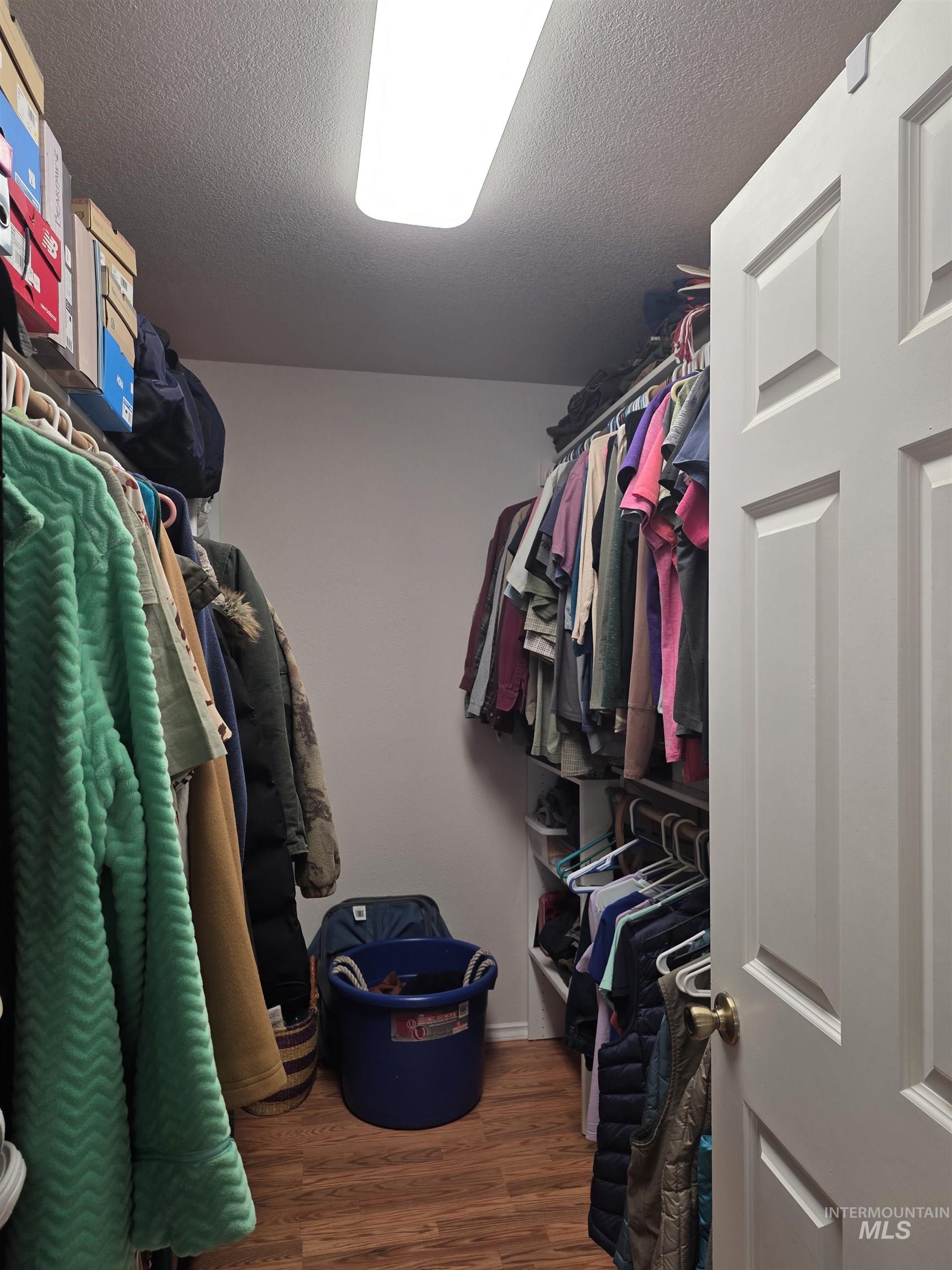 5288 Lakeview Road Orofino, ID 83544 - Photo 21 of 36 Walk in closet with dark wood-style floors