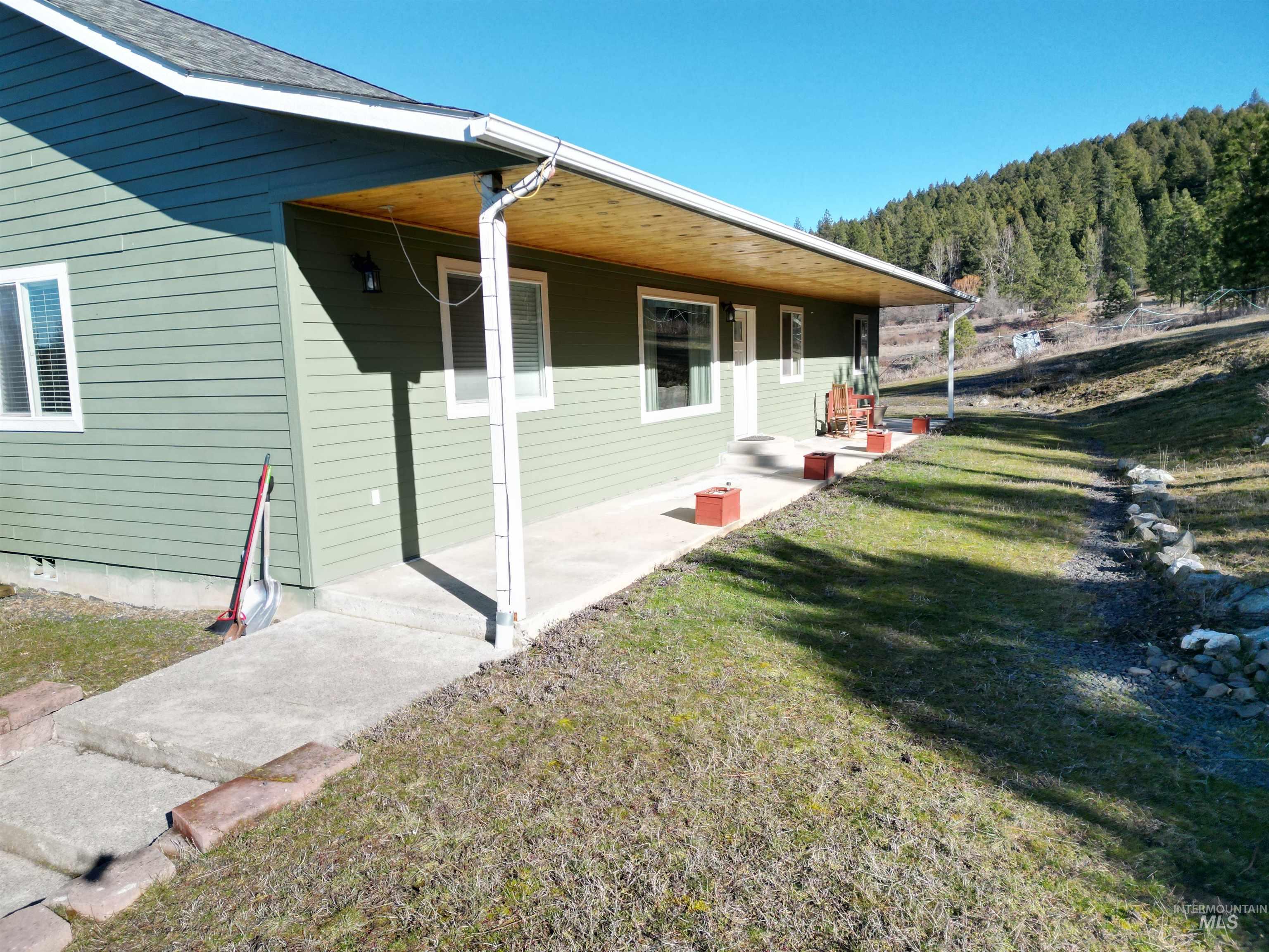 5288 Lakeview Road Orofino, ID 83544 - Photo 4 of 36 View of property exterior featuring a lawn and a porch