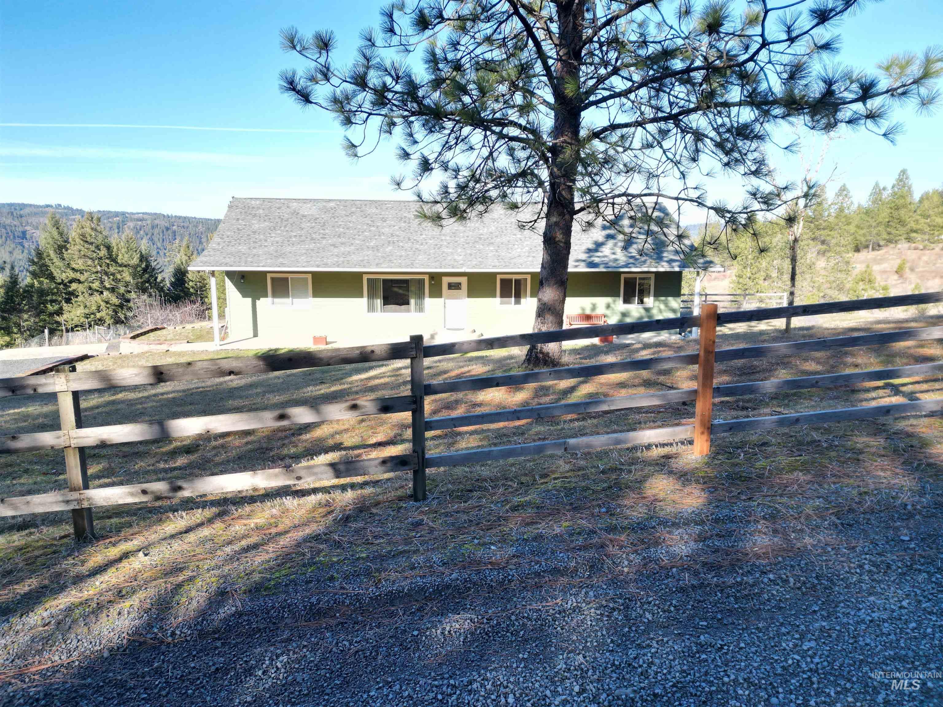 5288 Lakeview Road Orofino, ID 83544 - Photo 6 of 36 View of front facade with a fenced front yard and roof with shingles