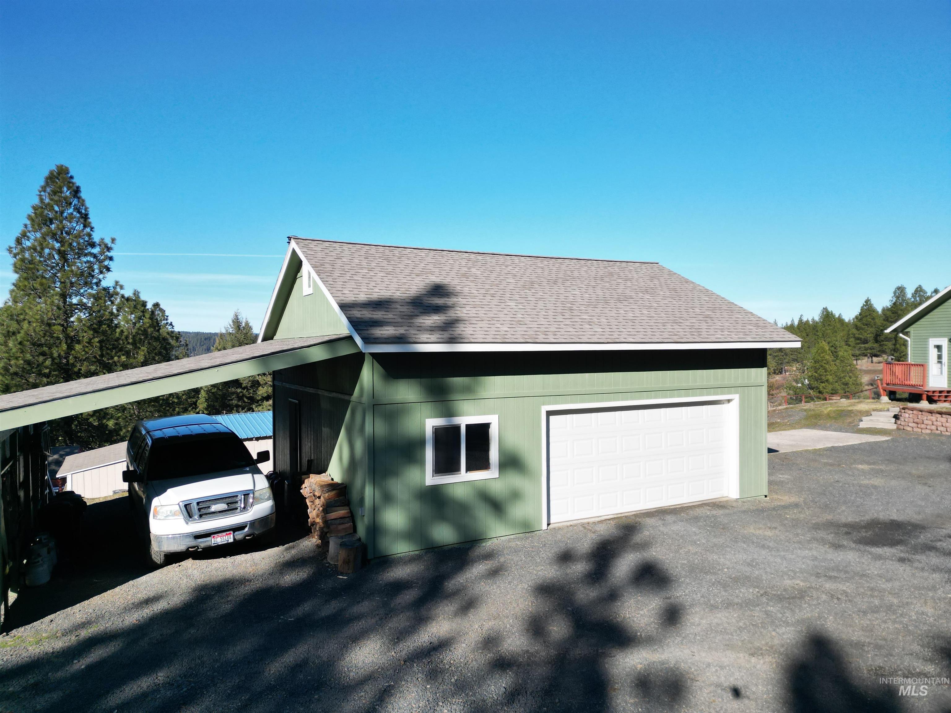 5288 Lakeview Road Orofino, ID 83544 - Photo 7 of 36 View of side of property featuring roof with shingles and an outdoor structure