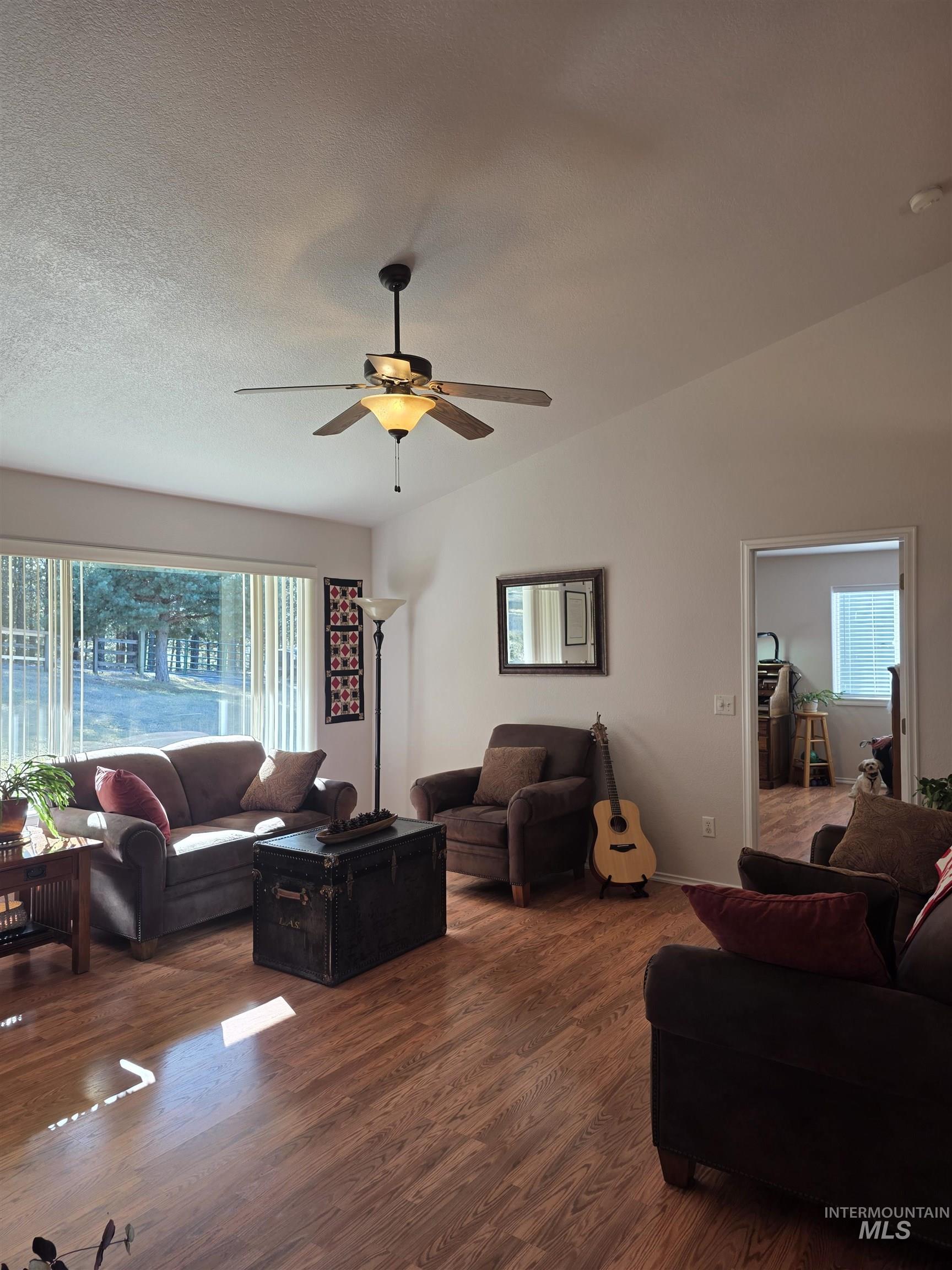 5288 Lakeview Road Orofino, ID 83544 - Photo 9 of 36 Living area with dark wood finished floors and a ceiling fan