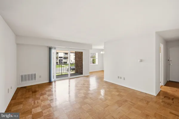 a view of an empty room with a window